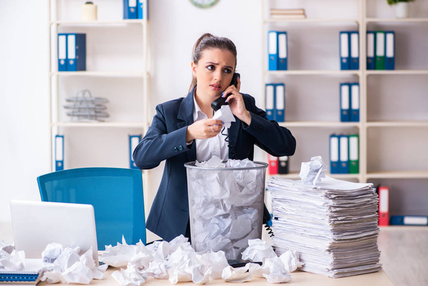 Businesswoman rejecting new ideas with lots of papers - 写真・画像