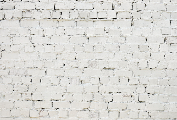 Una pared de ladrillo de textura áspera blanca pintada con pintura blanca
 - Foto, Imagen