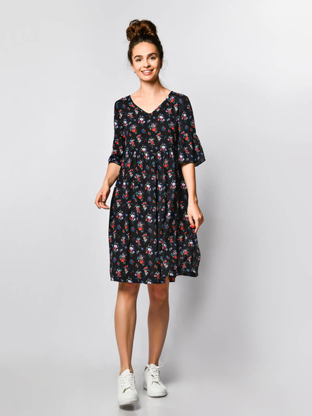 Woman in Long Floral Dress in Fashion Store - Portrait of girl in a clothes shop in a maxi summer dress - Foto, afbeelding
