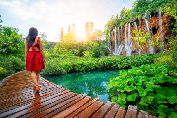 Traveler walk on path in Plitvice Lakes, Croatia. - Photo, Image