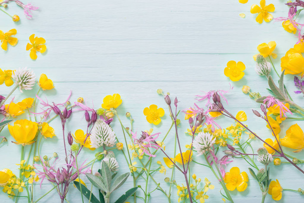 summer flowers on green wooden background  - Zdjęcie, obraz