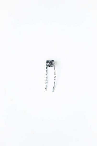 One coil on the white background - Foto, afbeelding