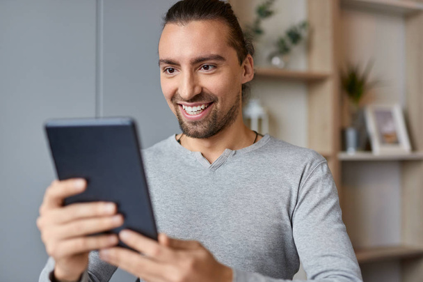 Smiling male making video call - Photo, image