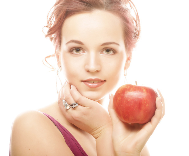 Young girl with a red apple in hand - Фото, зображення