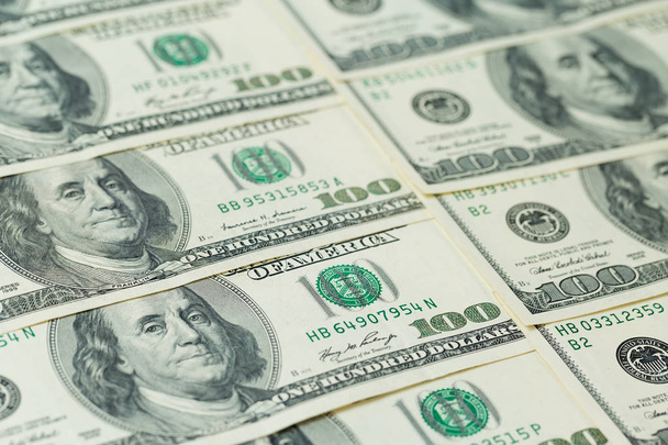 Background of one hundred dollar bills. Benjamin Franklin on USA money banknote - Photo, Image