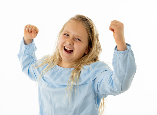 Close up portrait. Cute charming happy, excited, funny, cheerful young kid celebrating victory and having fun. Positive human emotions and people education and happy childhood concept. - Foto, afbeelding