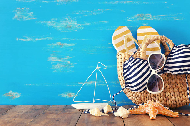 vacation and summer concept with sea life style objects over wooden table - Foto, Imagen