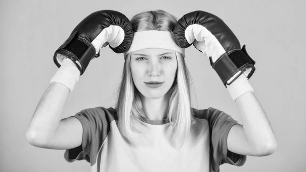 Girl painful face embrace head with boxing gloves. Headache concept. Keep calm and get rid of headache. Beat headache. Girl boxing gloves tired to fight. Strong woman suffer pain. Headache remedies - Zdjęcie, obraz