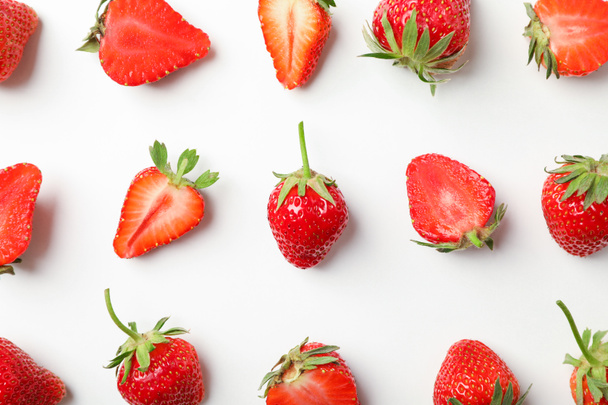 Flat lay composition with strawberries on white background, clos - Фото, изображение