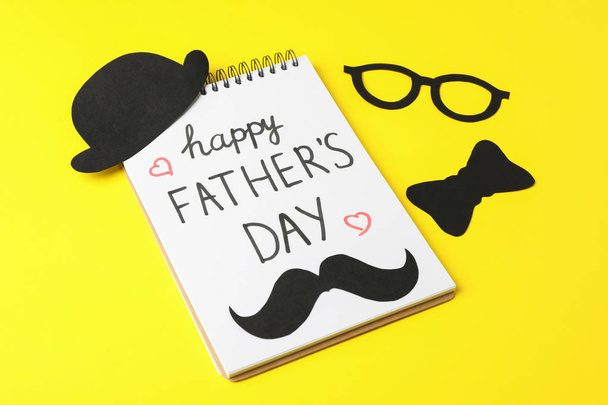 Notebook with inscription happy fathers day, decorative bow tie, - Photo, Image