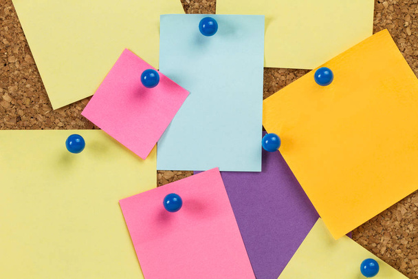 Sticky notes hanging on a cork board - Photo, Image