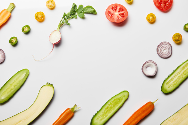 top view of fresh sliced vegetables on white background with copy space - Fotografie, Obrázek