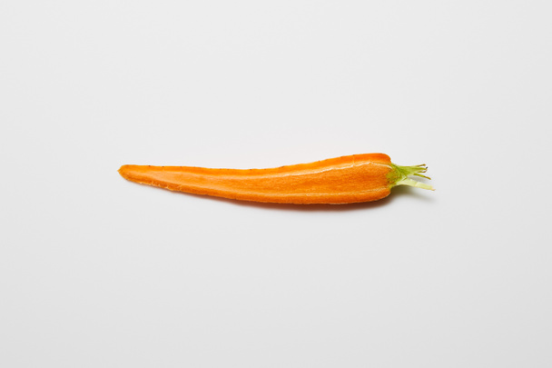 top view of fresh carrot slice on white background - Foto, imagen
