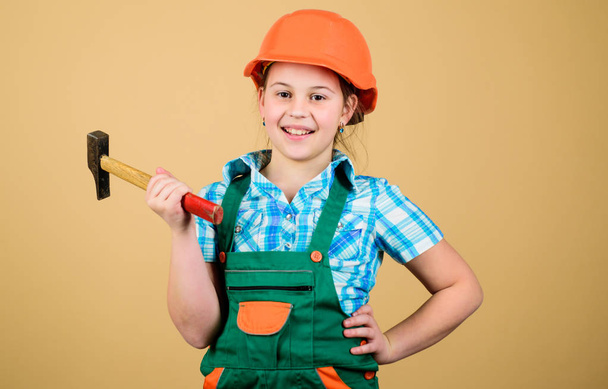 Child care development. Future profession. Builder engineer architect. Kid builder girl. Build your future yourself. Initiative child girl hard hat helmet builder worker. Tools to improve yourself - Foto, afbeelding