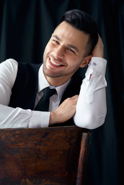 Portrait of happy smiling elegant man on black background - Fotoğraf, Görsel