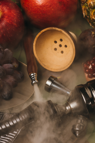 selective focus of fresh tasty fruits and hookah with smoke - Fotó, kép