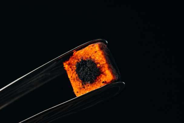 hookah tongs and hot coal isolated on black - Foto, Imagen