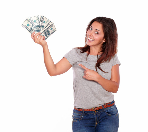 Charming young woman holding cash dollars - 写真・画像
