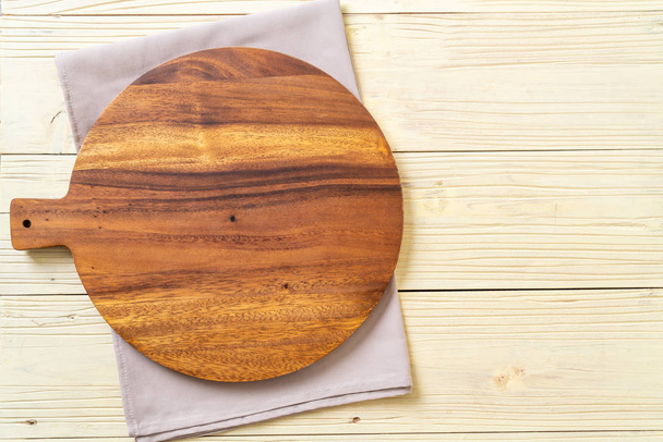 empty cutting wooden board with kitchen cloth - Photo, Image