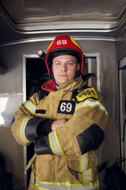 Image of man fireman on background of fire truck - Foto, Bild