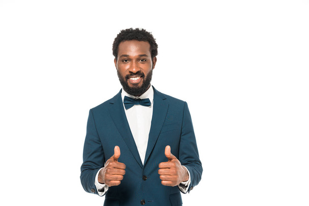handsome african american bridegroom showing thumbs up isolated on white  - Фото, зображення