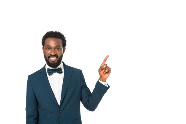 happy african american bridegroom pointing with finger isolated on white  - Photo, Image
