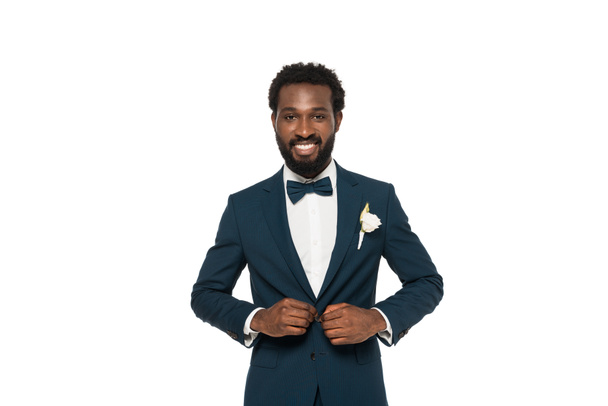 cheerful bearded african american man touching suit isolated on white  - Фото, зображення