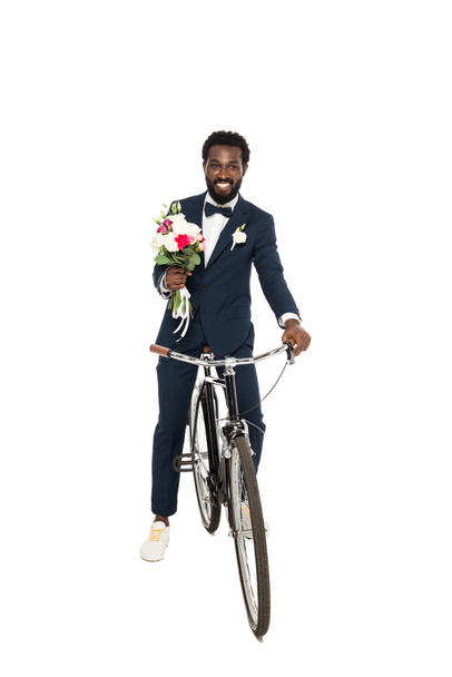happy african american man holding bouquet and bicycle isolated on white  - Φωτογραφία, εικόνα