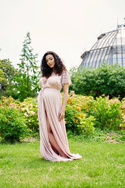 Gorgeous pregnant woman in summer park - Fotó, kép