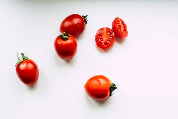 Tomatoes on a white sill - Фото, зображення