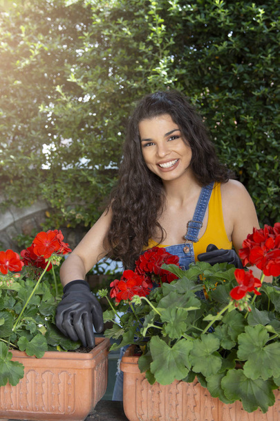 Beautiful young woman gardening with garden tools, spring concept - Photo, Image