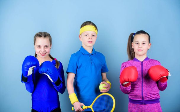 Never stop. workout of small girls boxer and boy in sportswear. Happy children in boxing gloves with tennis racket and ball. Fitness energy health. punching knockout. Team sport success - Фото, изображение