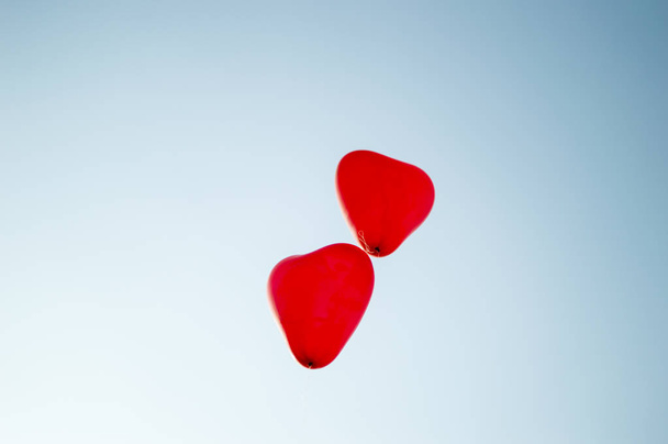 Heart shaped balloons going in the air - Photo, Image