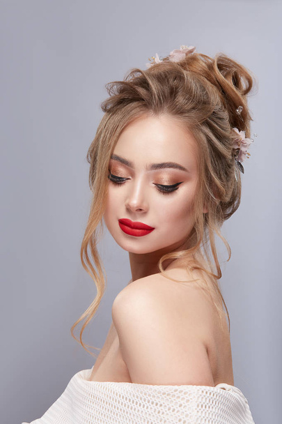 portrait of beautiful woman with red lipstick posing on grey backdrop - Фото, зображення