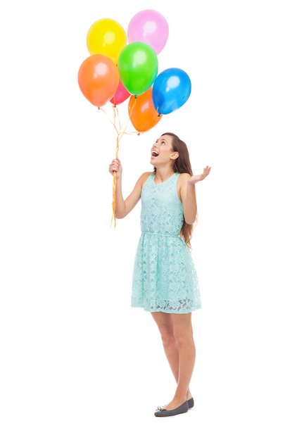 Woman holding a bunch of balloons - 写真・画像