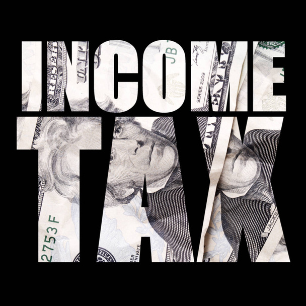 Jövedelemadó-felirat, készpénz belső fekete háttér - Fotó, kép