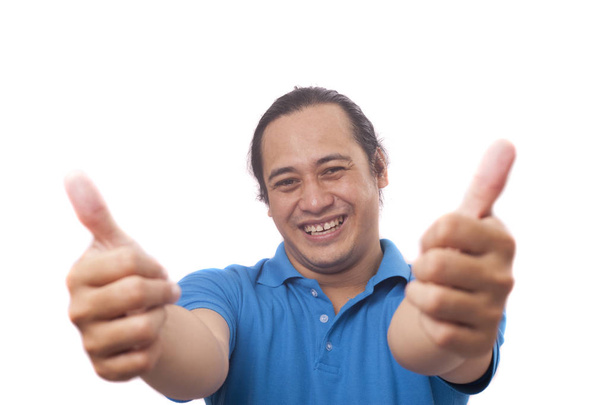 Young Man Showing Thumbs Up Gesture OK Sign - Valokuva, kuva