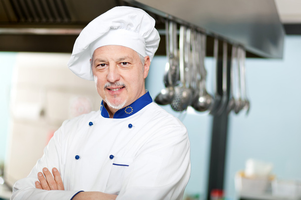 Smiling chef in his kitchen - 写真・画像