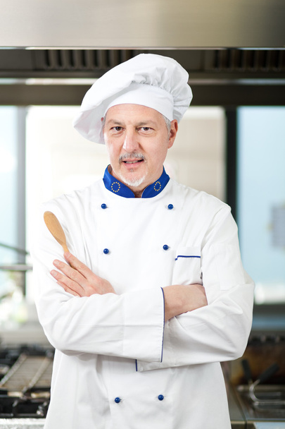 Smiling chef in his kitchen - Valokuva, kuva