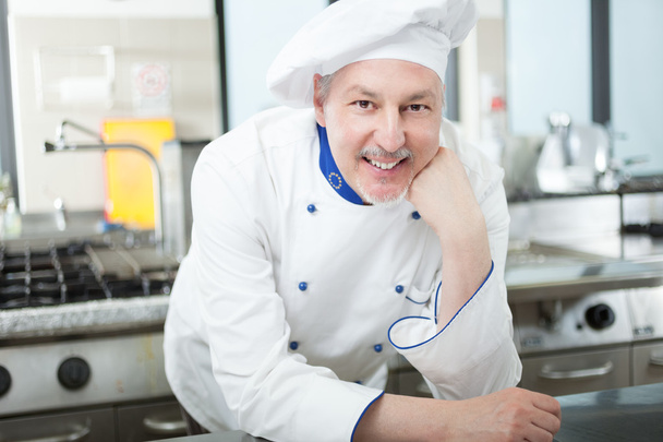 Portrait of a chef in his kitchen - Fotó, kép