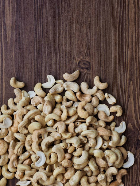 Cashew nuts with wooden board - Fotoğraf, Görsel