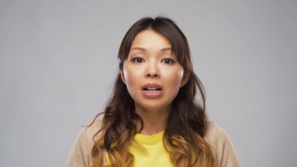 shocked asian woman with open mouth - Felvétel, videó