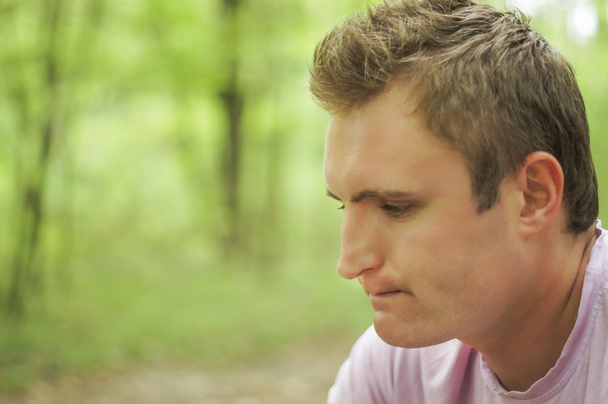 Thoughtful young man Outdoors - Photo, image