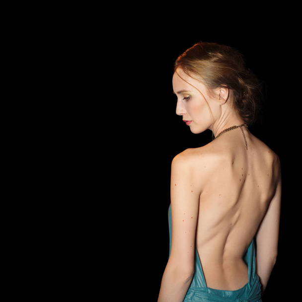 Portrait of beautiful girl with bare back in profile - Photo, image