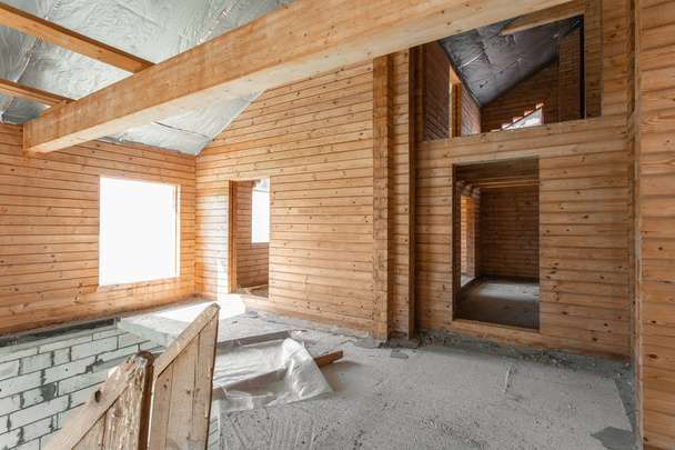 attic floor of the house. overhaul and reconstruction. Working process of warming inside part of roof. House or apartment is under construction, remodeling, renovation, restoration. - Photo, Image