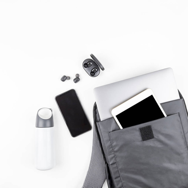 Modern backpack with laptop and tablet inside - 写真・画像