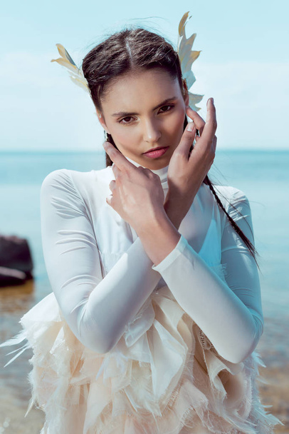 portrait of adult woman in white swan costume looking at camera - Φωτογραφία, εικόνα