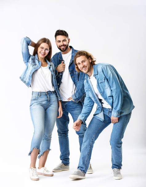 Stylish young people in jeans clothes on white background - Foto, Imagem