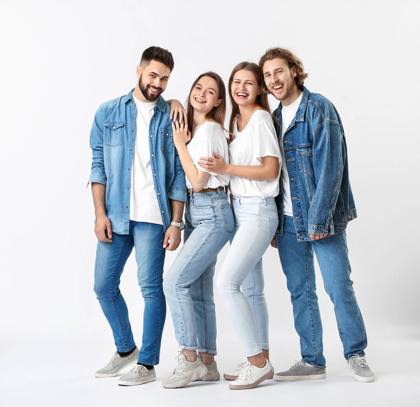 Stylish young people in jeans clothes on white background - Fotografie, Obrázek