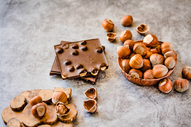 Homemade hazelnut chocolate bar. Nuts and chocolate background.  - Photo, Image